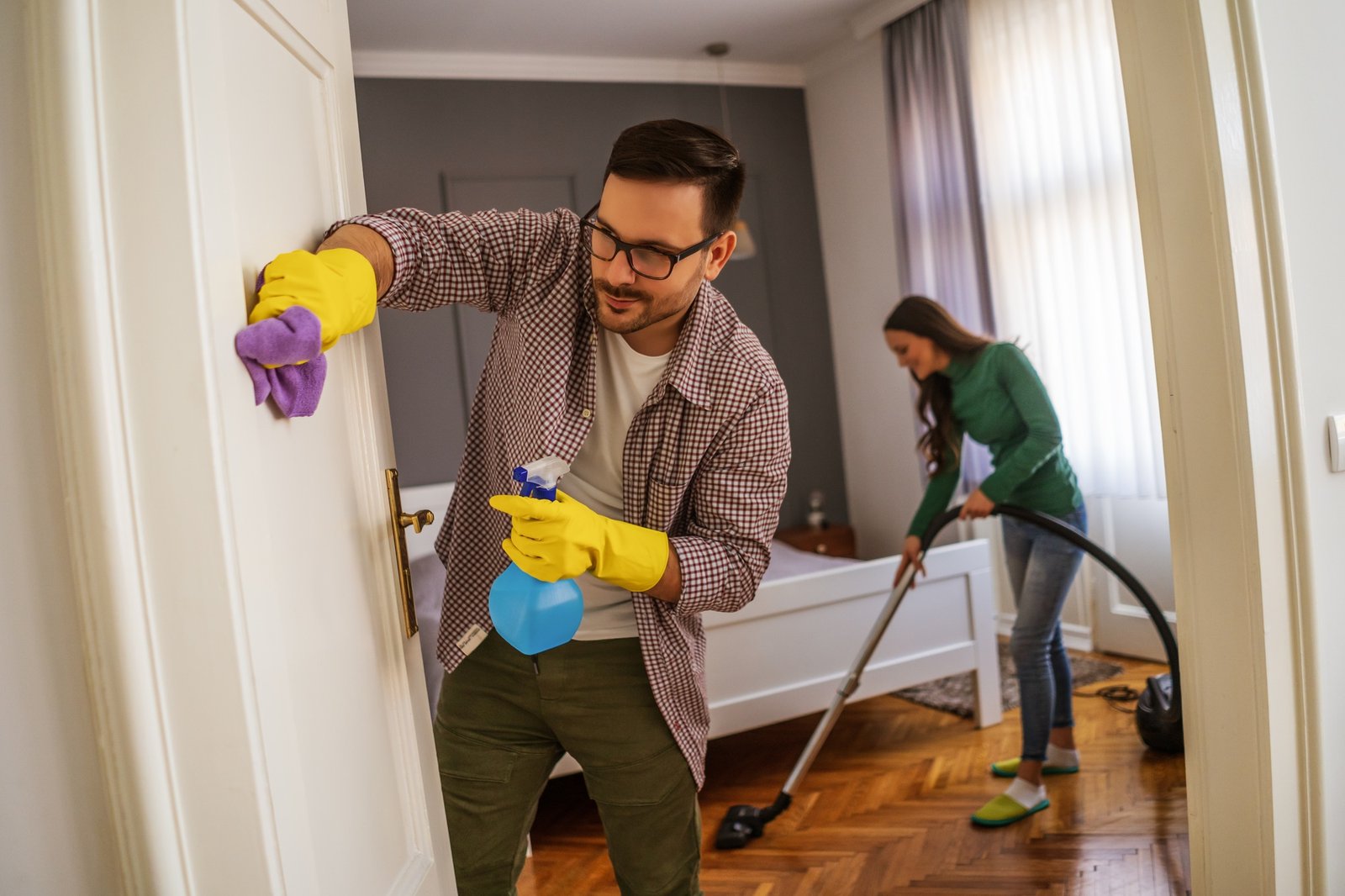 Couple cleaning their home